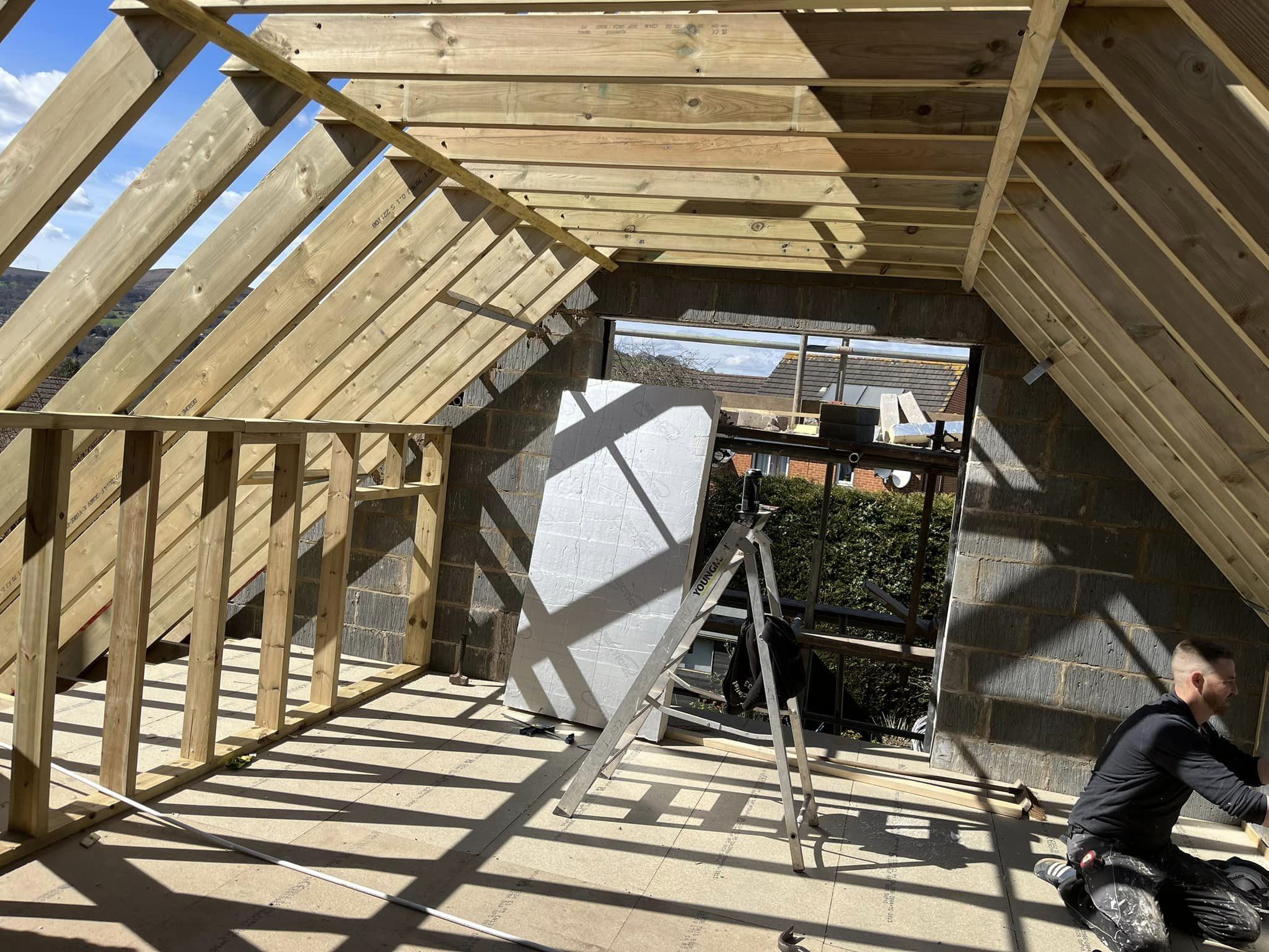 Extension with the roof being built