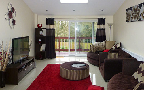 Inside a living room with black and brown furnishings