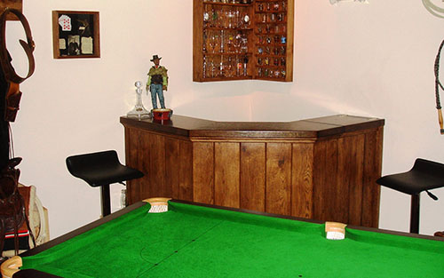 Pool table and bar area in home